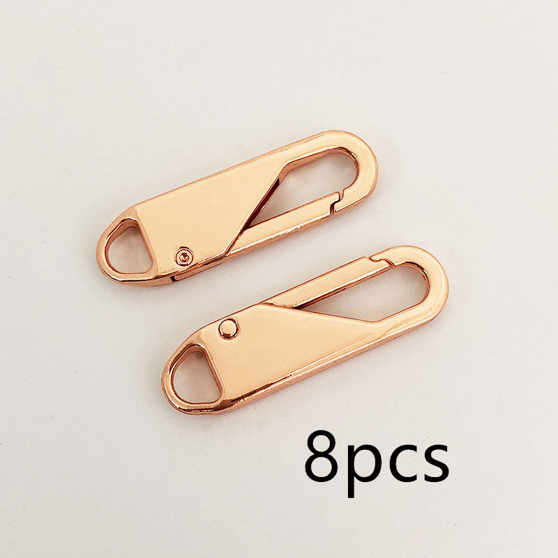 Close-up of CJdropshipping wholesale leather bag zippers and zipper accessories, showing zipper heads and detachable zipper pieces.