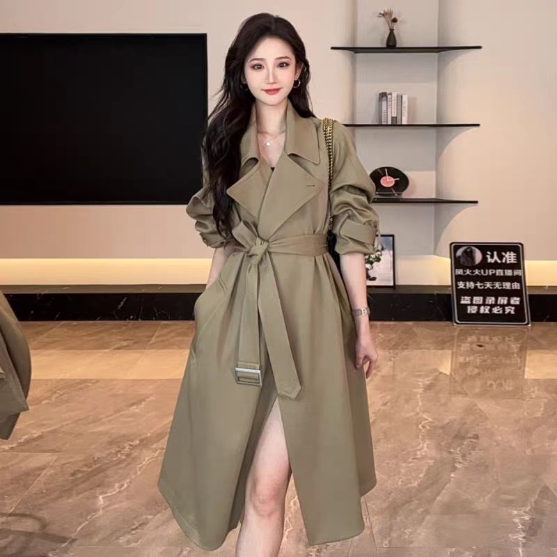 Long beige CJdropshipping classic belted trench coat with double-breasted buttons and waist belt, displayed on a hanger.